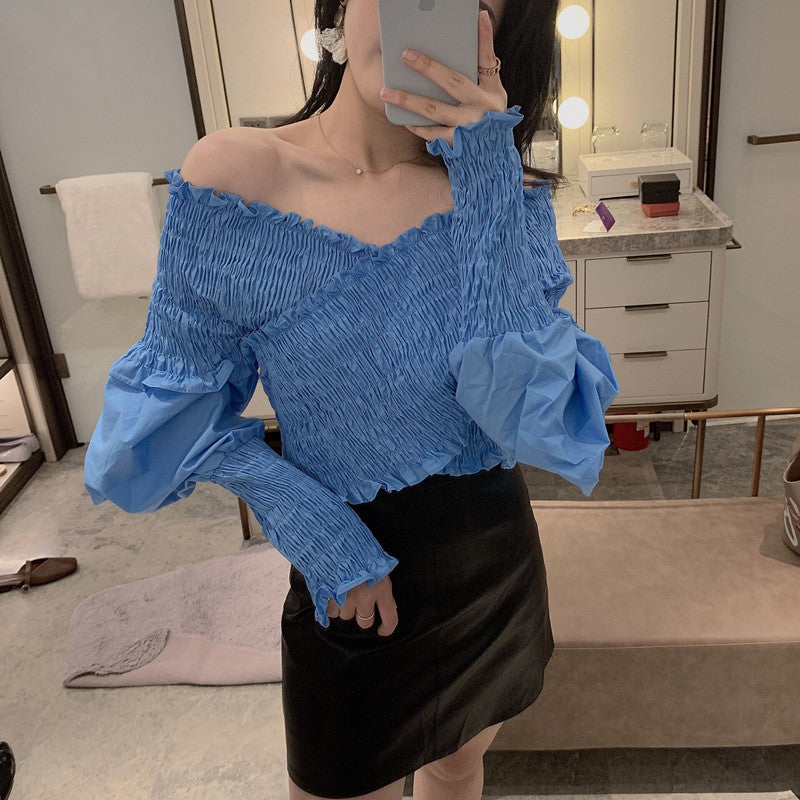Burq | Modern off-shoulder blouseshirt met pofmouwen