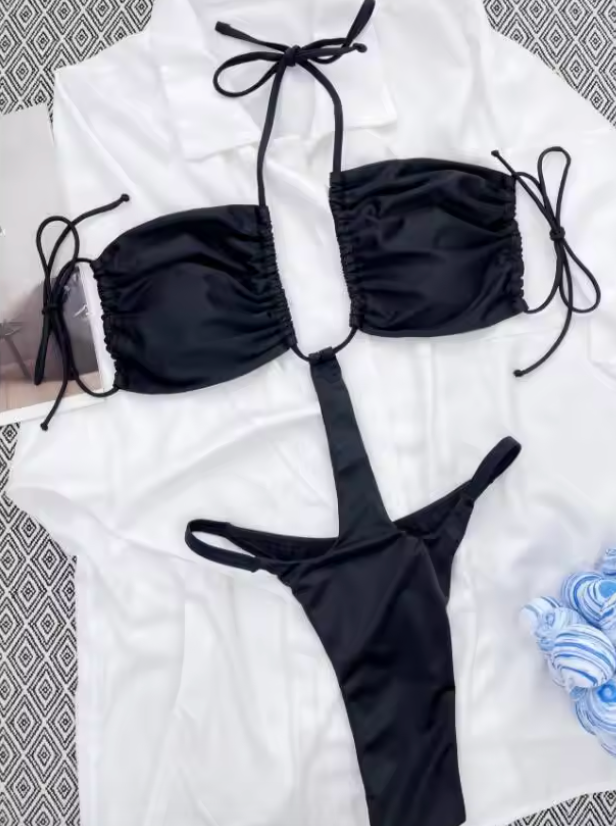 Burq | Zwarte monokini met uitsnijdingen en strikdetails